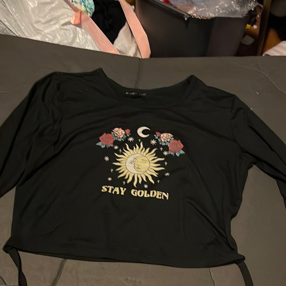 Long sleeved black crop top with sun and moon logo